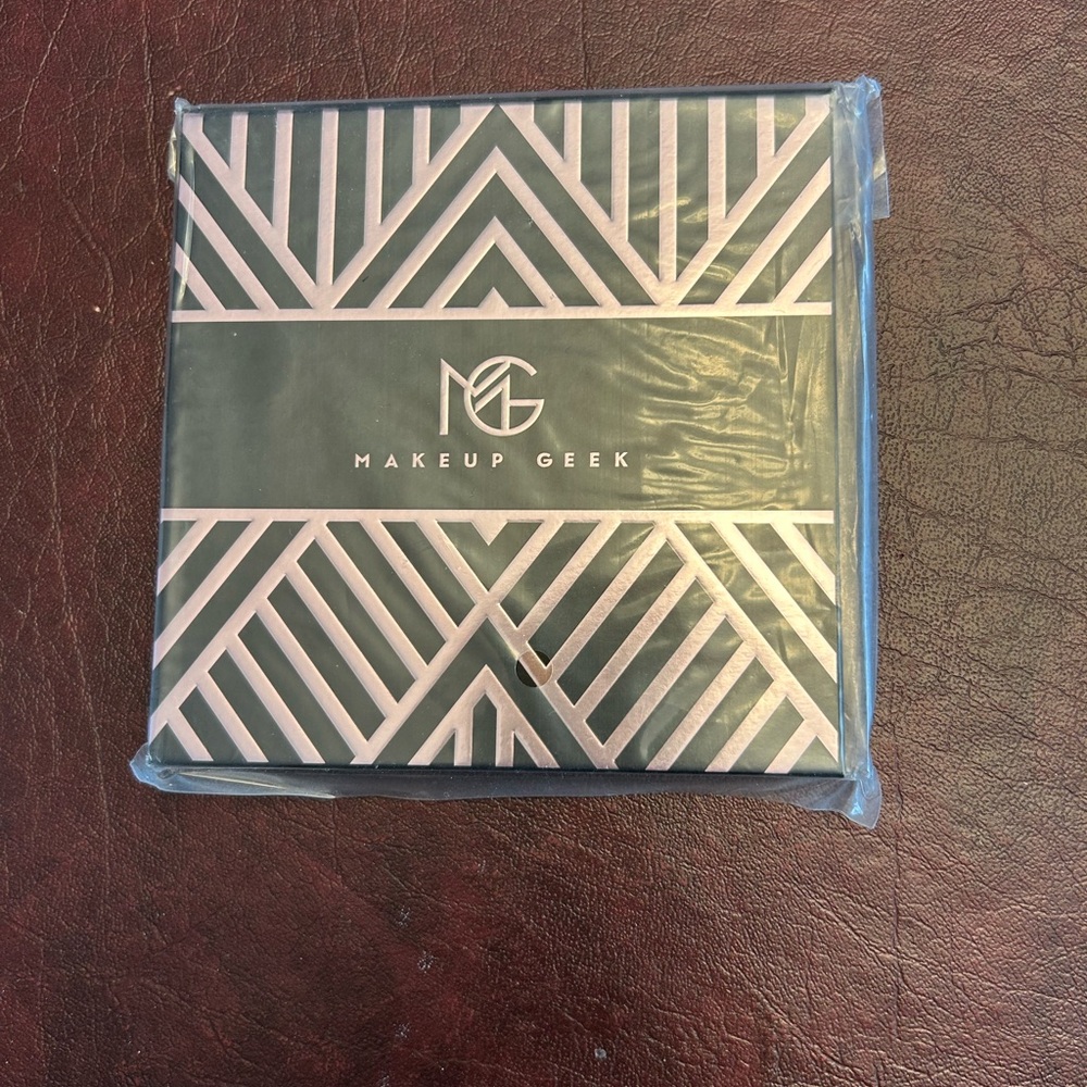 Makeup Geek empty magnetic eyeshadow palette. 
Brand new without box